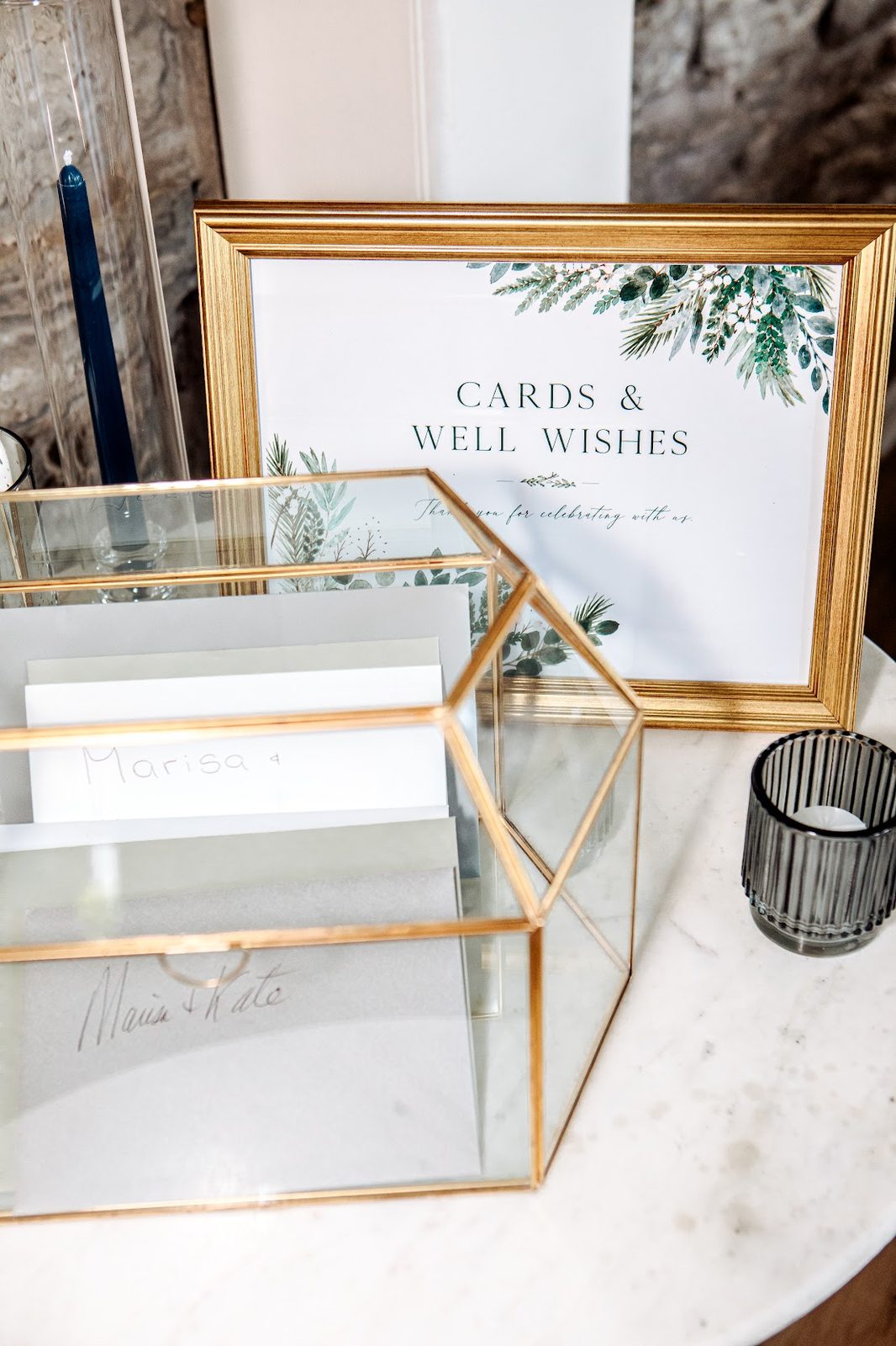 Cards and Well Wishes sign next to a glass card holder box
